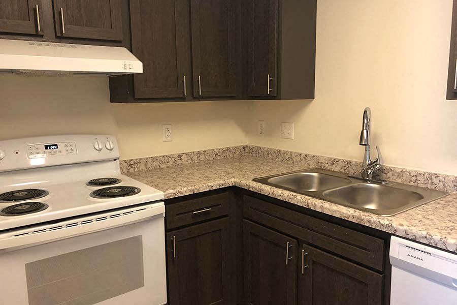 a kitchen with a stove and a sink