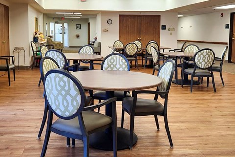 A room with tables and chairs.