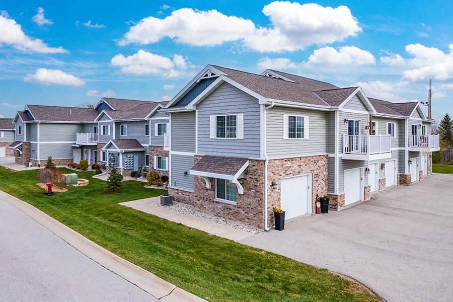 a row of houses on the side of a street