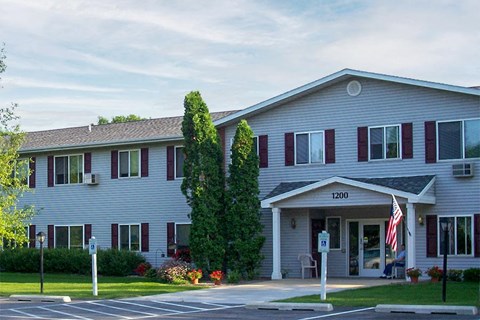 a white building with an flag in front of it