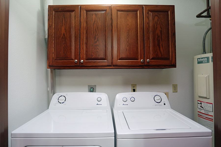 A white washer and dryer in a laundry room.