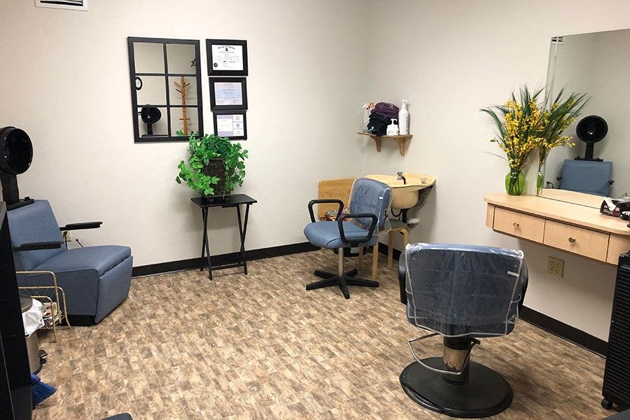 an office with chairs and a desk in a room