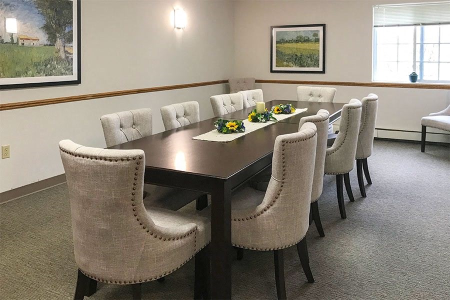 a conference room with a table and chairs