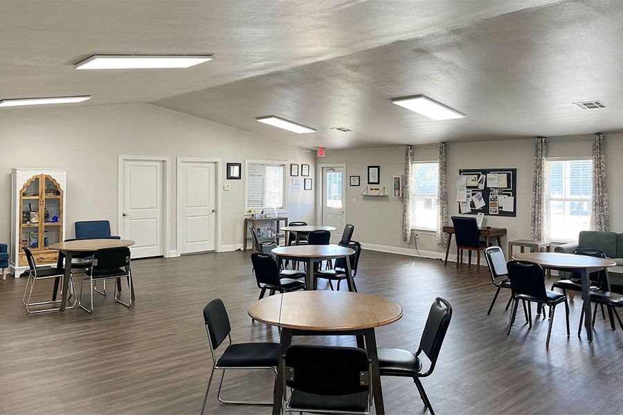 a dining room with tables and chairs in a building