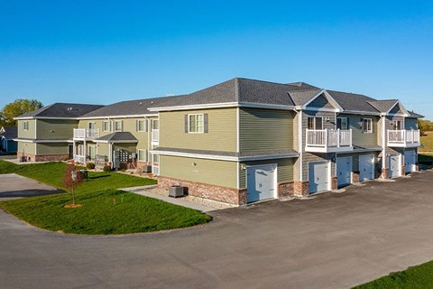 a row of houses on the side of a street