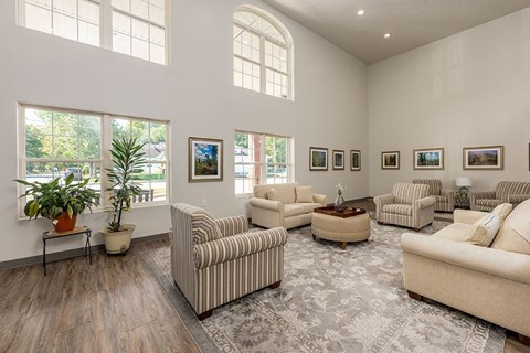 A living room with a striped couch and a coffee table.