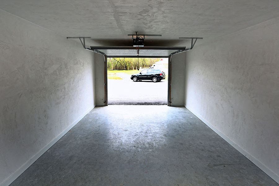 a car parked in the end of a garage