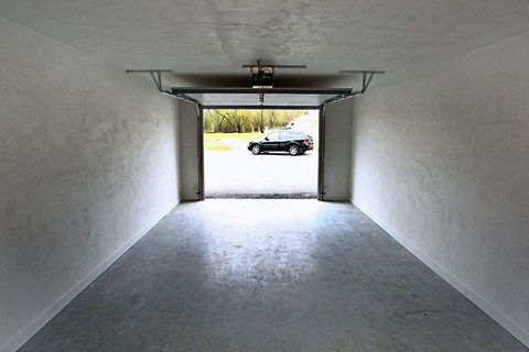 a car parked in the end of a garage