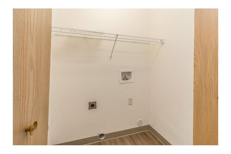 a white bathroom with a shower and a door