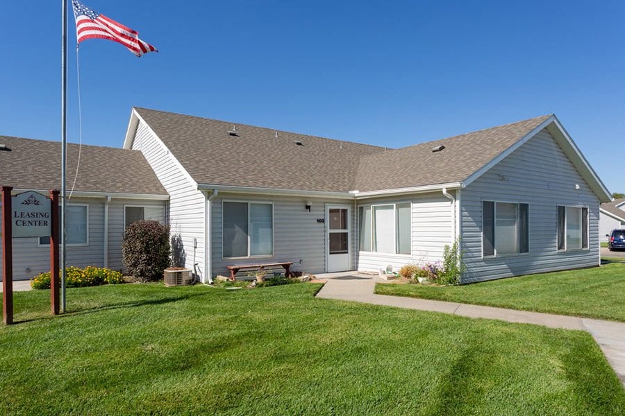 a white house with an flag in front of it
