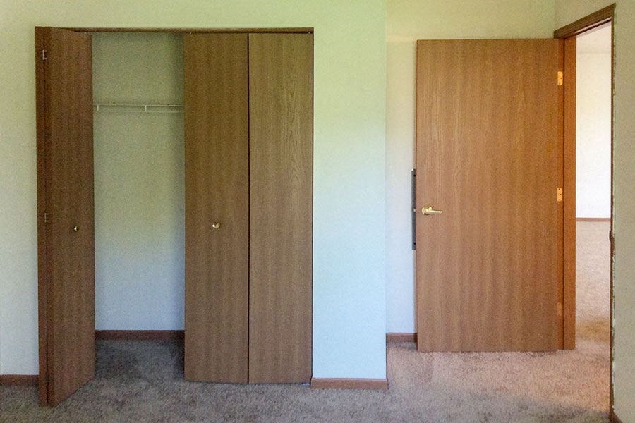 an empty room with two doors