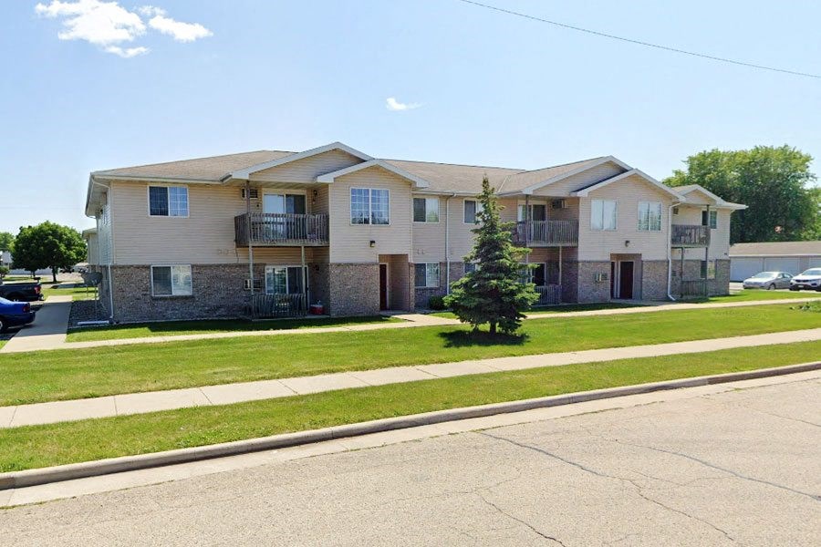 an apartment building on the side of a street