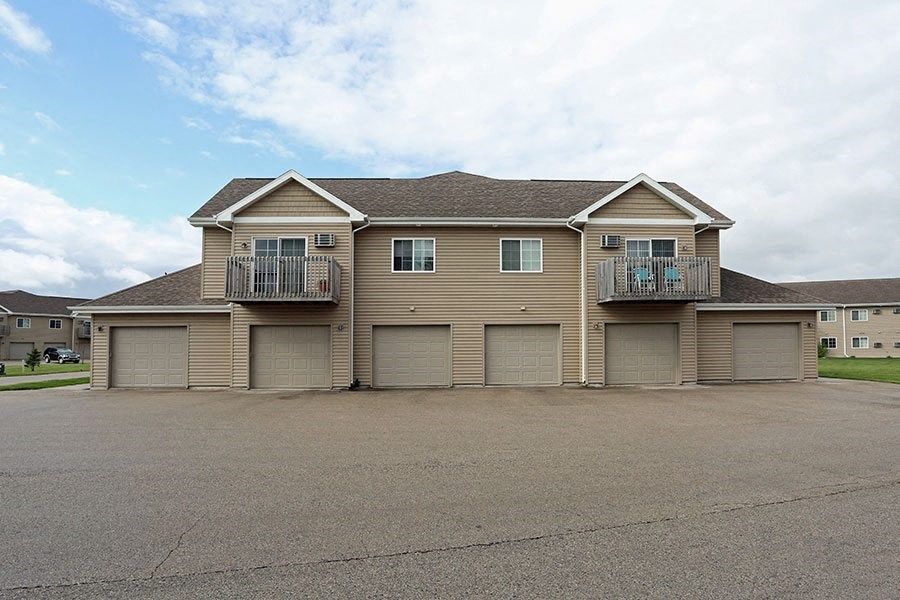 a large house with many garage doors