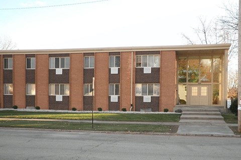 a brick building with steps in front of it
