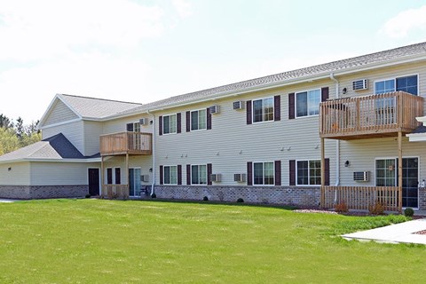 a large white house with a yard in front of it