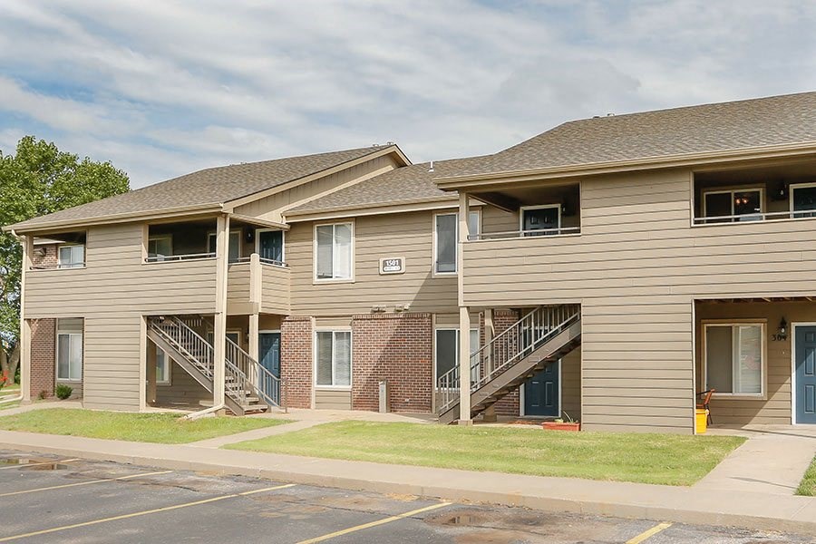 a row of houses with balconies and stairs