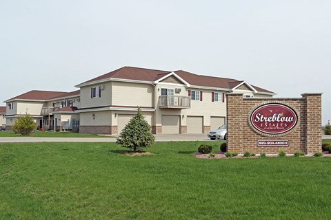 A Strelbow Estates sign is in front of a house.