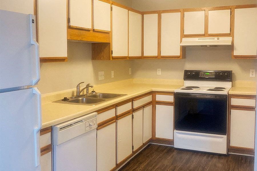 a kitchen with a stove and a sink