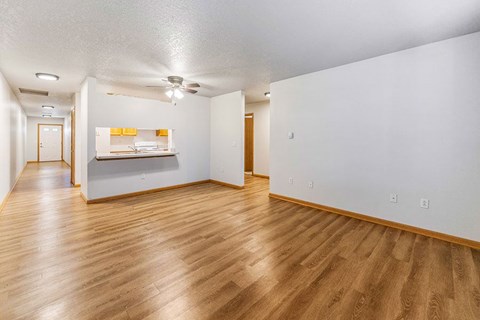 A room with wooden floors and white walls.