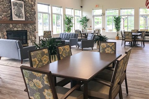 a dining room with a table and chairs and a fireplace