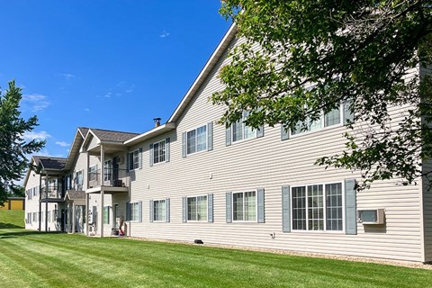 A large two-story house with a balcony on the second floor.