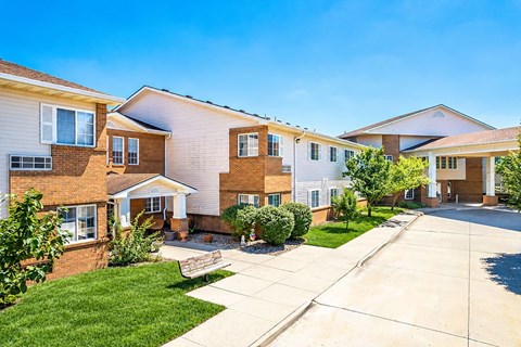 A row of houses with a clear blue sky above them.