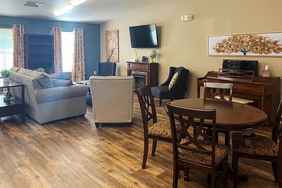 a living room with a table and a couch and a tv