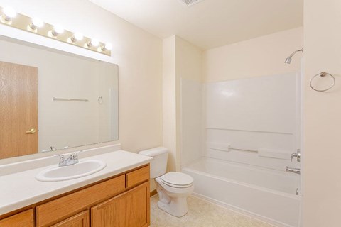 a bathroom with a sink toilet and a bath tub