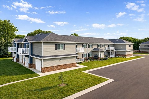 A row of houses with a clear blue sky above them.