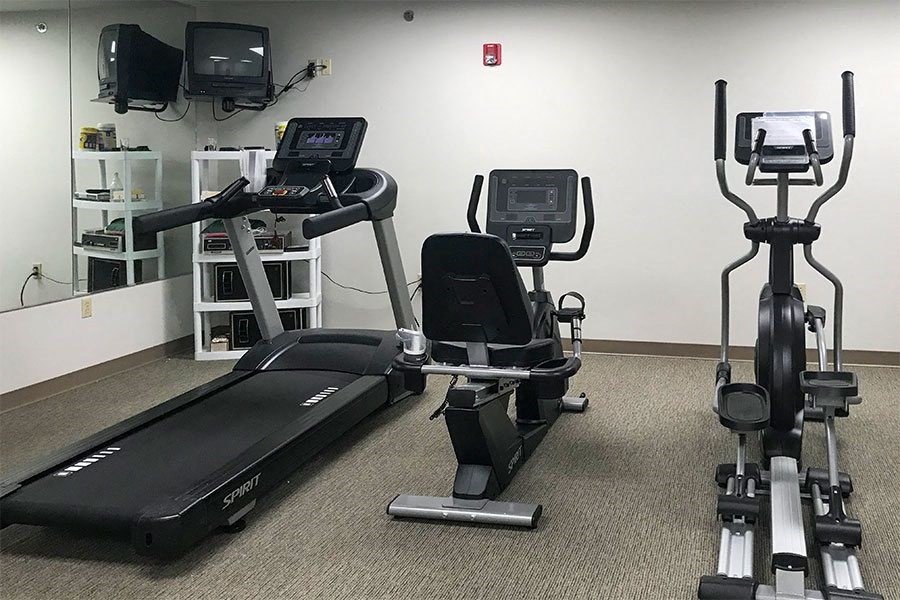 a gym with some exercise equipment in it