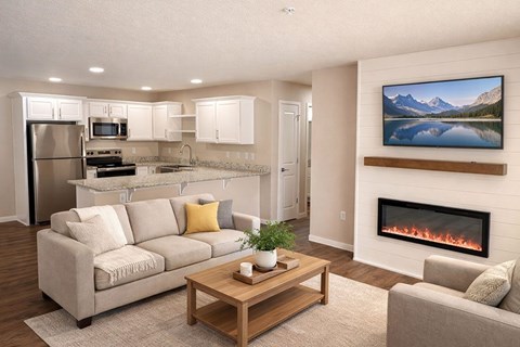 A modern living room with a fireplace and a painting of a mountain lake on the wall.