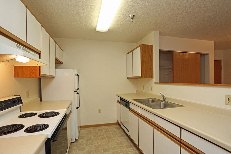 a kitchen with a stove and a sink