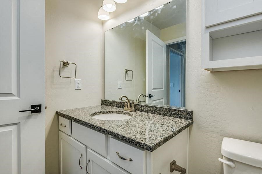 a bathroom with a sink and a mirror