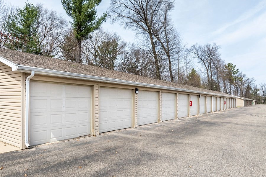 A long row of garage doors are closed.