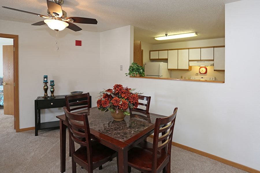 a dining room with a table and chairs