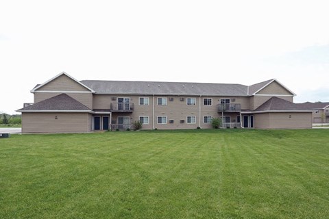 a large house with a lawn in front of it