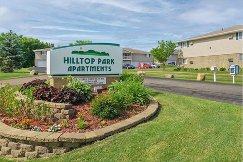 the sign apartments on the side of the street