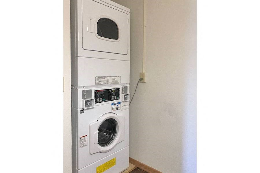 a washing machine and a dryer in a wall