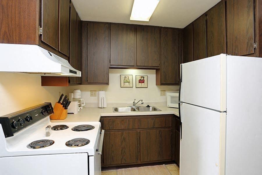 a kitchen with a stove and a refrigerator