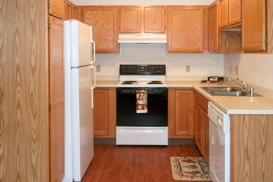 a kitchen with a stove and a refrigerator