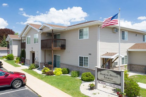 an flag flying in front of an apartment building