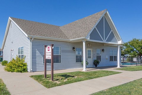 A small building with a sign that says "LIVING ONLY" in front of it.