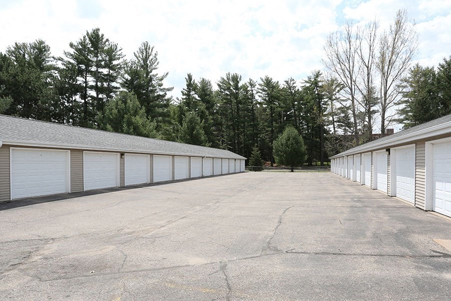 a long row of garage doors in a parking lot