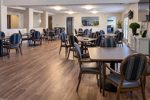 A room with wooden floors and furniture.