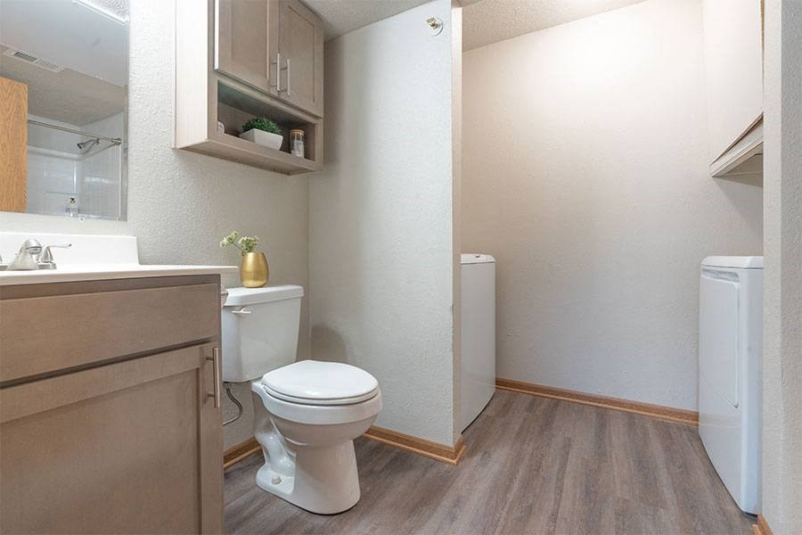 a bathroom with a toilet and a sink