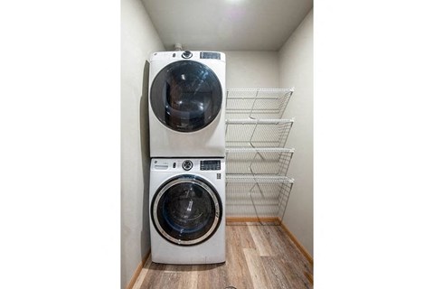 a washing machine and a dryer in a room