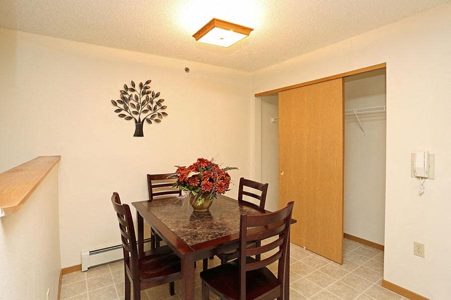 a dining room with a table and chairs