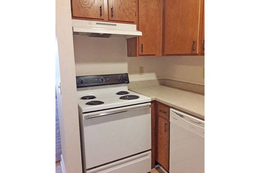 a kitchen with a stove and a stove top oven