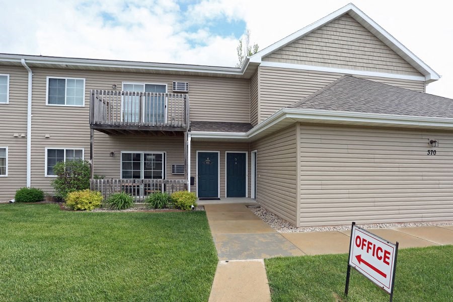 a house with an open office sign in front of it