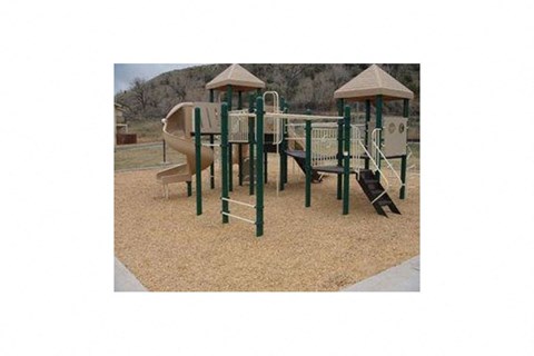 a playground with a jungle gym and a slide